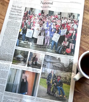 A photo of The New York Times with a coffee cup in the frame