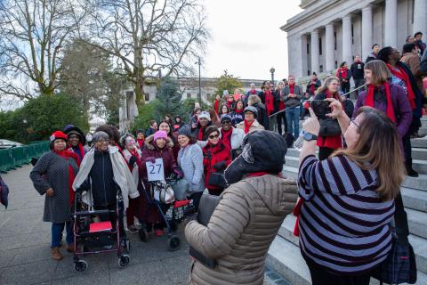 Advocates in their red scarves gather on the Capitol steps in Olympia during HHAD in 2020.